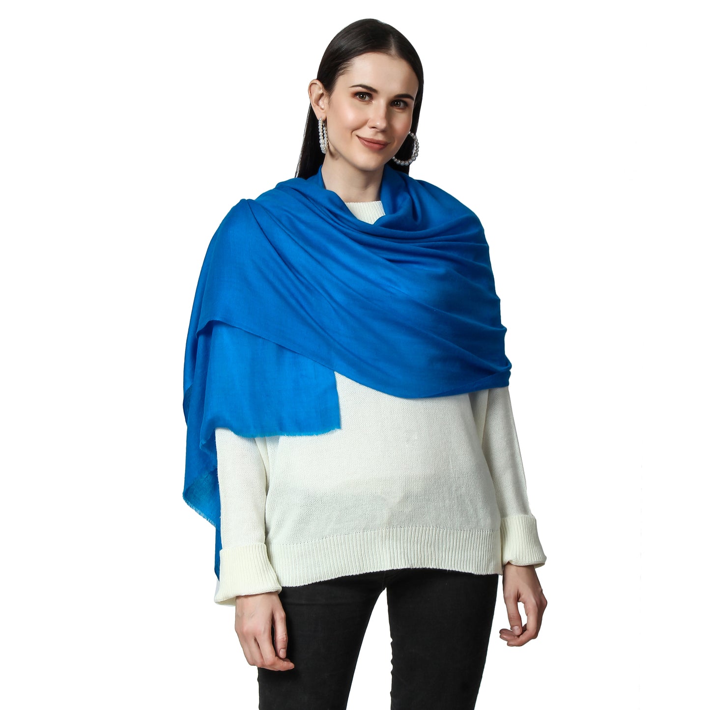 A woman wearing a Sapphire Cashmere scarf